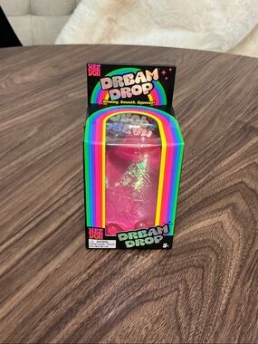 Dream Drop Squeeze Toy by — Bright Pink Sensory Plush-Feel Fidget